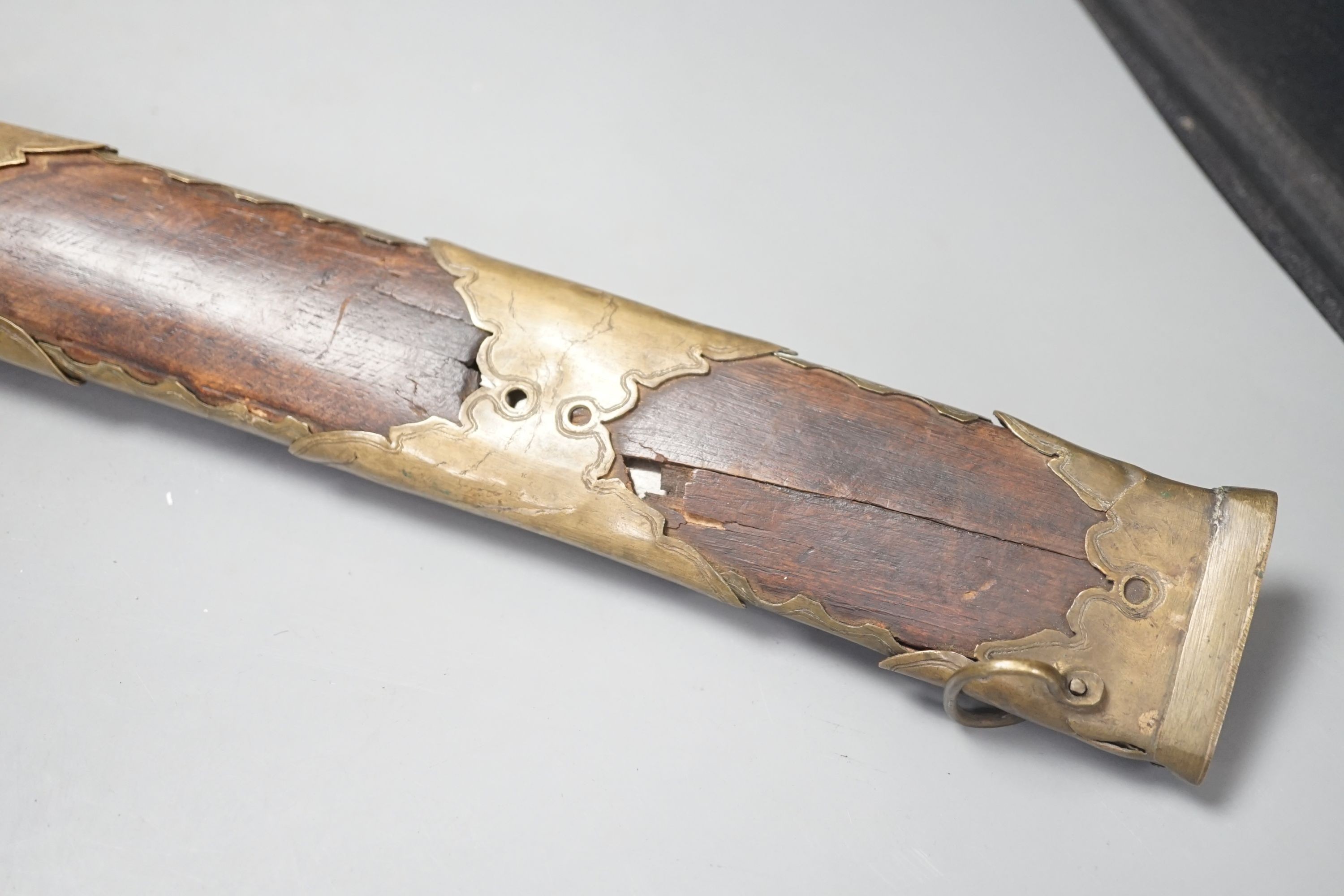 An Ottoman Empire brass-mounted percussion rifle with dual-action concealed barrel sword blade, total length 71cm